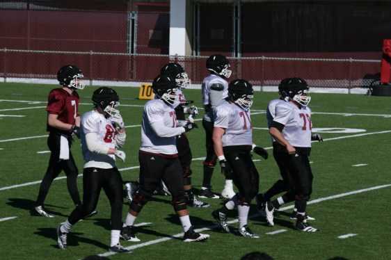 Our starting quarterback, #7 Blake Fronapfel with the offensive line 